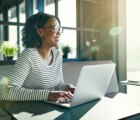 smiling woman at a computer