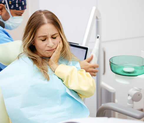 woman at the dentist in pain