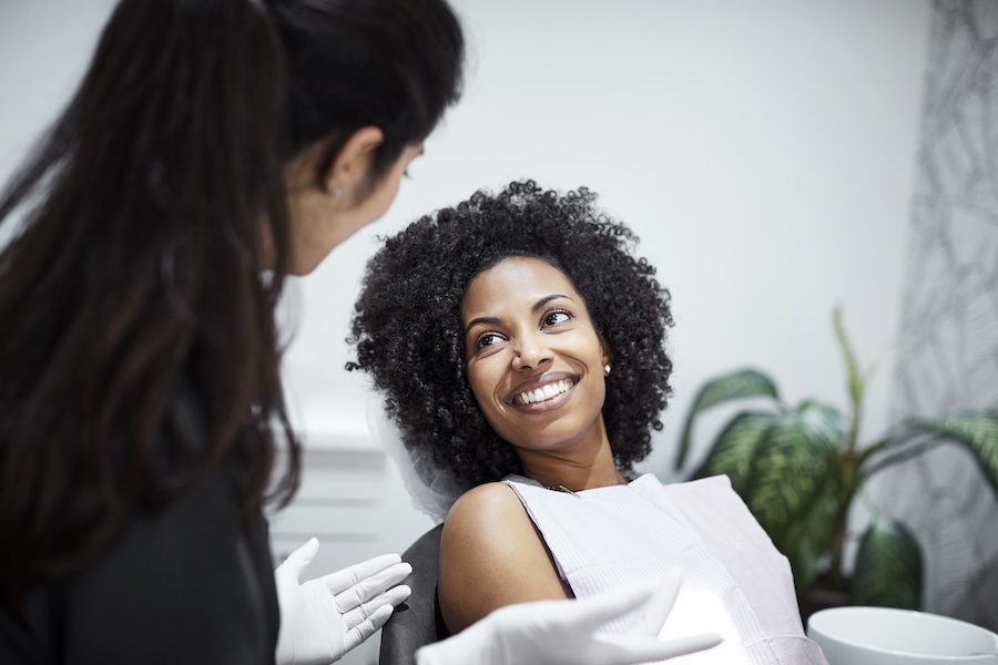 woman in dental chair for preventive professional regular dental check-up