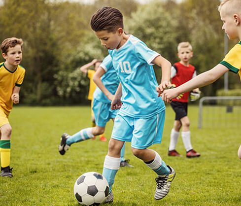 boy playing soccer