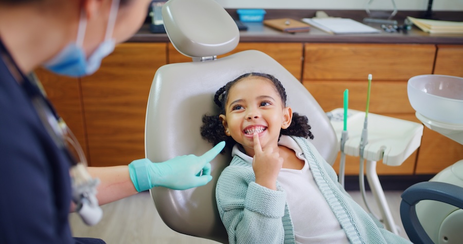 girl at dentist for cleaning during a family block appointment